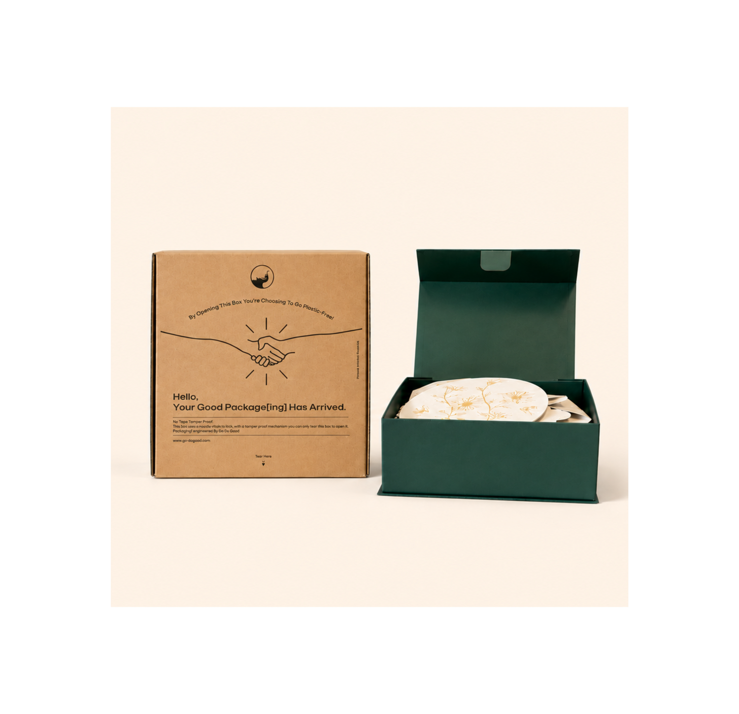Open green box with a white product inside next to a brown cardboard box on a beige background