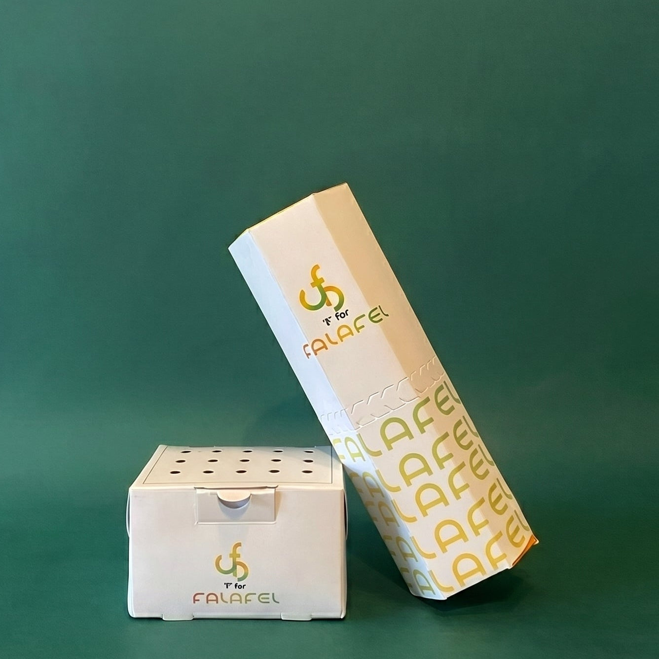 Two boxes with a logo on a green background
