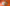Brown paper bag with a handle against an orange background
